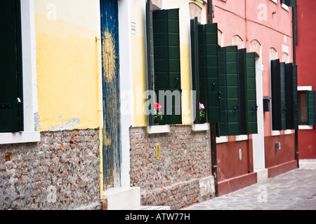 A row of colourful terraced houses Burano Veneto Italy Stock Photo