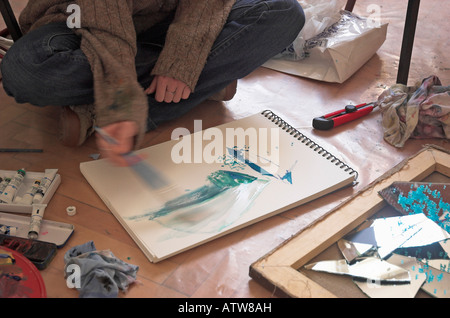 Young female art student painting Stock Photo