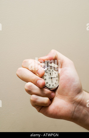 Hand holding stopwatch chronometer Stock Photo