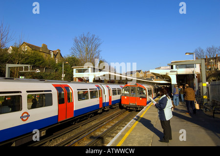 Trains arriving at Ealing Common station W5 London United Kingdom Stock Photo