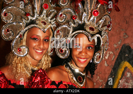 https://l450v.alamy.com/450v/atx2dk/close-up-portrait-of-two-young-girl-smiling-carnival-dancers-in-costume-atx2dk.jpg