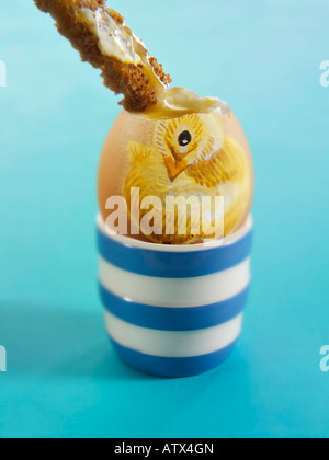 Painted Easter Egg with a Chick illustration, soft Focus. Boiled egg with soldier Stock Photo