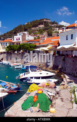Circular walled harbour with colorful fishing boats at Nafpaktos Greece Stock Photo