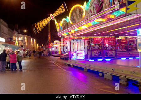 Fairground rides at night in Kings Lynn Stock Photo