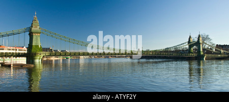 Hammersmith Bridge crossing River Thames at Hammersmith London England UK Stock Photo