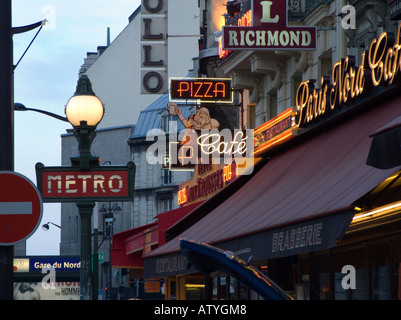 Paris France Signs opposite Gare du Nord railway station in the capital Stock Photo