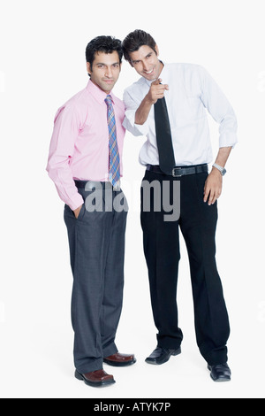 Two businessmen standing together and smiling Stock Photo