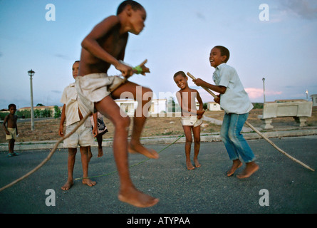 Dominican boys playing on a street in El Castillo in northwest Dominican Republic Stock Photo