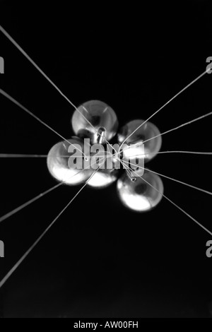 newtons cradle all tangled up Stock Photo