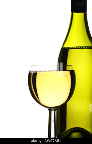 wine bottle and glass of freshly poured white wine Stock Photo