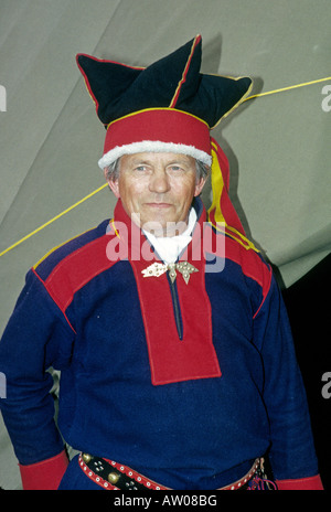 A portrait of a Sami or Lapp reindeer herder dressed in traditional clothing in Lapland Stock Photo