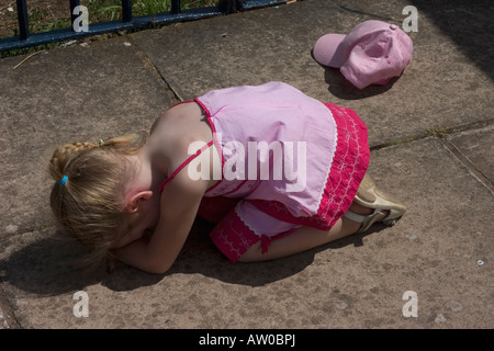 Young girl throwing off hat and having a tantrum. Stock Photo