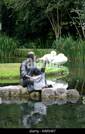 IRL  Bronze figure of St Fiacre by a pond in a garden which bears his name close to Irelands National Stud -Kildare Ireland Stock Photo