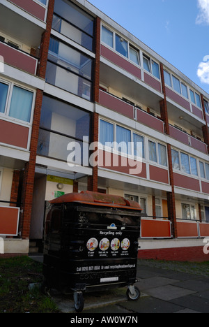 Recycling bin dominating the entrance to a block of flats in Roehampton, South West London Stock Photo