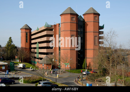 Red brick multi storey car park with turrets overlooking suburban Sutton, southwest London, England Stock Photo