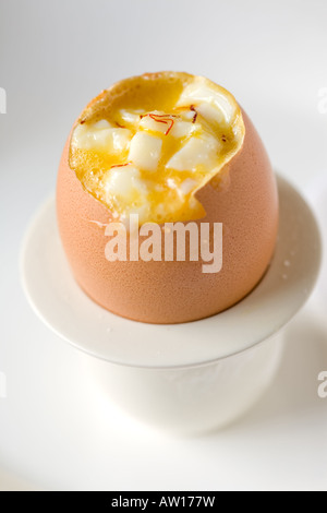 Soft cooked egg mixed with safraan and olive oil Stock Photo