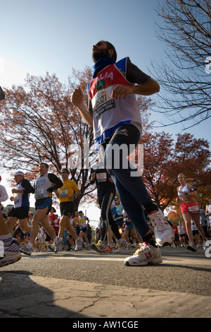 Low angle shot competitors in the 2006 ING New York City Marathon near the 10 mile mark in Brooklyn 5 November 2006 JMH1866 Stock Photo