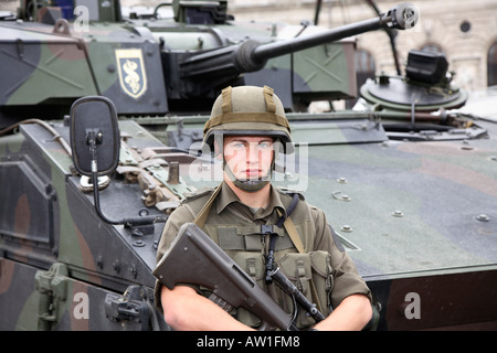 Young soldier, recruit in front of a tank on the Heldenplatz (heroes square) in Vienna, Austria Stock Photo
