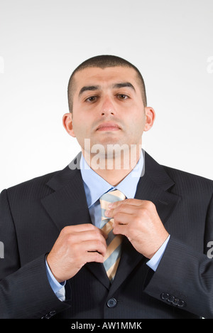 Business man fixing his tie Stock Photo