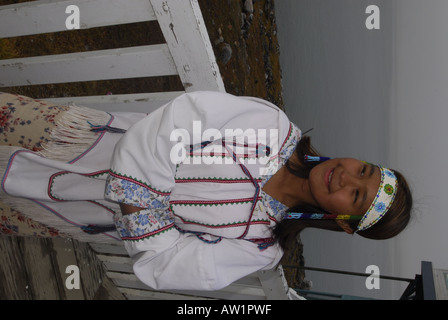 Model released inuit teens throat singing wearing their traditional clothing MR Pond Inlet Baffin Island High Arctic Canada isol Stock Photo