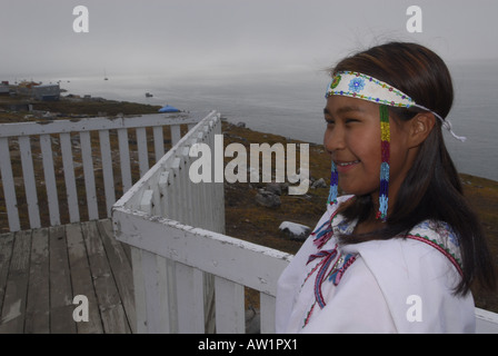 Model released inuit teens throat singing wearing their traditional clothing MR Pond Inlet Baffin Island High Arctic Canada isol Stock Photo