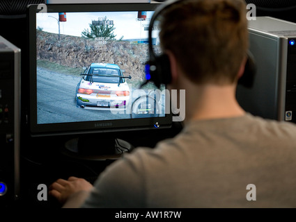 teenager during a Massively Multiplayer Online Playing Game computer game Stock Photo
