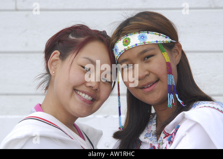 Model released inuit teens throat singing wearing their traditional clothing MR Pond Inlet Baffin Island High Arctic Canada isol Stock Photo