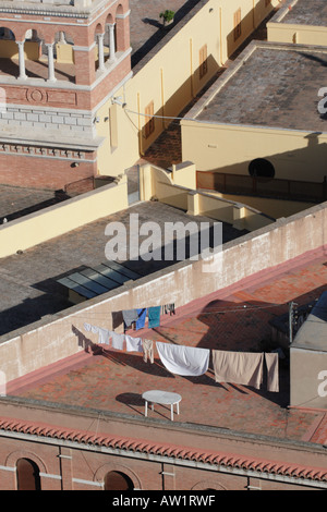 Washing line with clothes hanging to dry on rooftop in city centre Valencia Spain Stock Photo