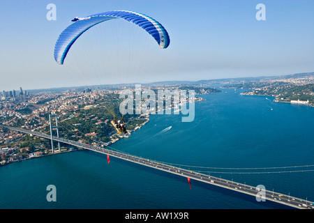 Powered paraglider flying over the Bosphorus Bridge aerial Istanbul 2010 European Capital of Culture Turkey Stock Photo