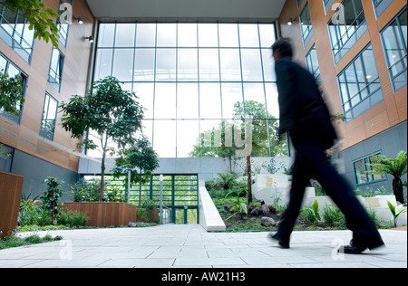 Man walking through an inner court Stock Photo