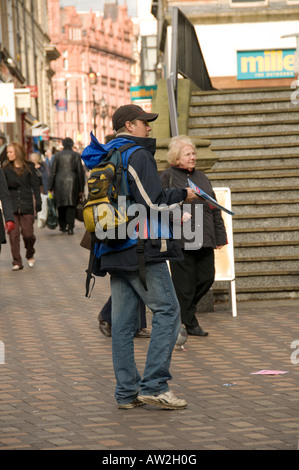 Selling the Big issue on the streets on Nottingham Stock Photo