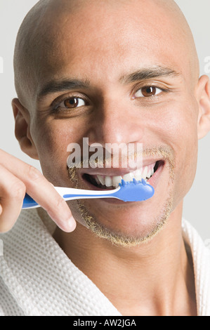 Man brushing his teeth Stock Photo