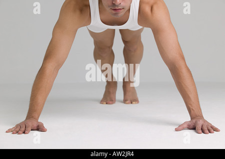 Man doing push ups Stock Photo