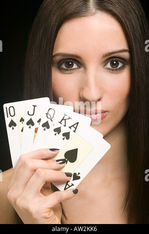 Woman holding playing cards Stock Photo