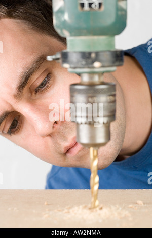 Man drilling Stock Photo