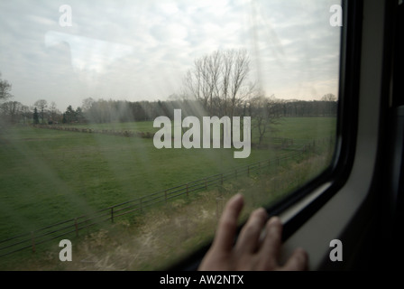 Looking through the window while travelling on train Stock Photo