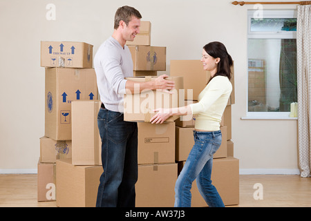 Couple with cardboard boxes Stock Photo