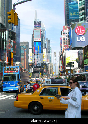 Times Square in daylight, yellow cab in foreground, USA, USA, New York (state) Stock Photo