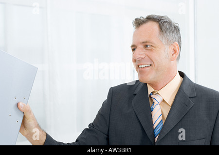 Businessman with ring binder Stock Photo