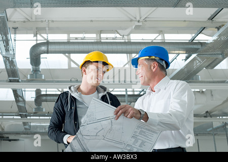 Architects with plans Stock Photo