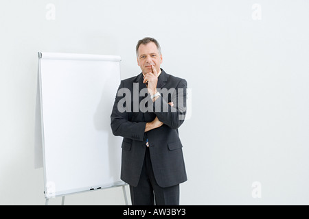Businessman and flipchart Stock Photo