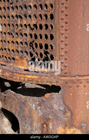 Close-up of the corroded, perforated tube plate and rivets of an old iron steam boiler - industrial archaeology, Funchal, Madeira, Portugal. Stock Photo