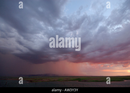 Heavy rain falls over the Matusadona Mountains in Zimbabwe's Matabeleland North province. Stock Photo