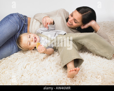 Daughter and mother playing. Stock Photo