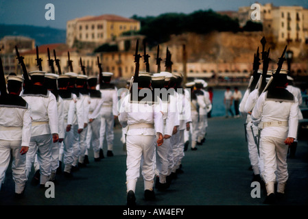Greek sailors marching through the streets of Chania, Crete in the evening, Greece Stock Photo
