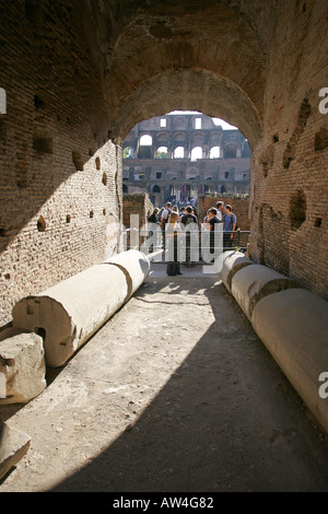 Unusual image of tour group exploring the world famous ancient ruins of the Colosseum in Rome Italy Europe EU Stock Photo