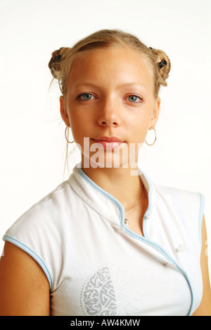Self-confident, serious looking young lady with braids. Young woman. Teenager. Girl. Stock Photo