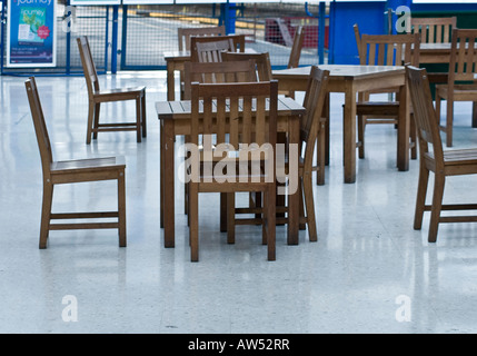 Empty Wooden table chairs unoccupied Stock Photo