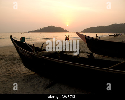 Fishing boats on Palolem beach in Goa in South India at sunset Stock Photo