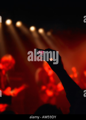Cell phone taking picture of a concert. Stock Photo